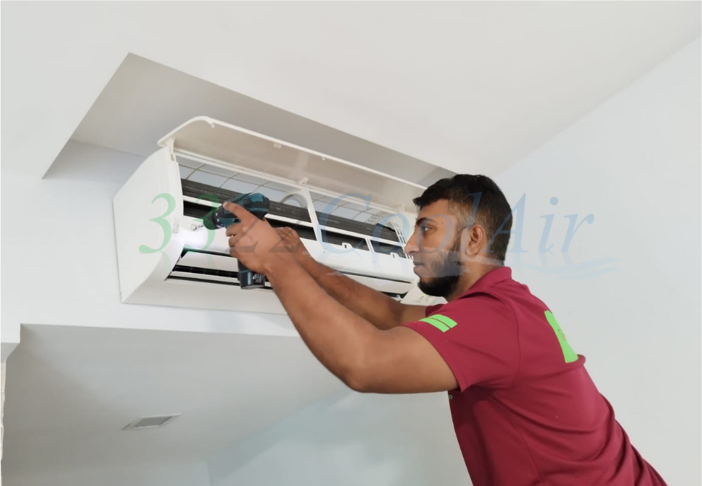 Technician conducting Aircon Servicing